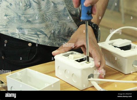 Male Electrican Fixing An Electrical Socket Stock Photo Alamy