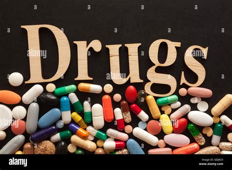 Word Drugs With Wooden Letters On Colorful Pills Stock Photo Alamy