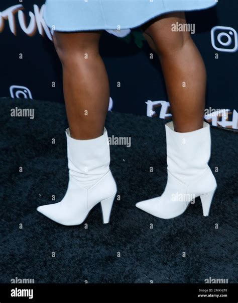 The Shoes Of Janelle Monae Poses At The Fem The Future Brunch To