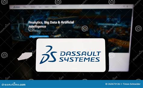 Person Holding Smartphone With Logo Of French Software Company Dassault Systemes Se On Screen In