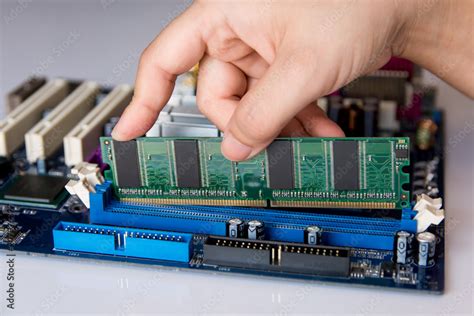 Technician Installing Ram Stick Random Access Memory To Socket On