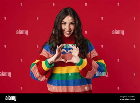 Joyful Beautiful Brunette Girl Making Heart Gesture With Fingers