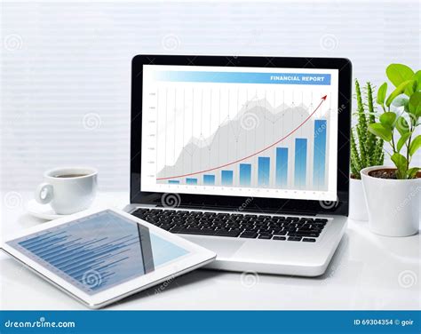 Financial Graphs On Laptop And Tablet Stock Photo Image Of Computer