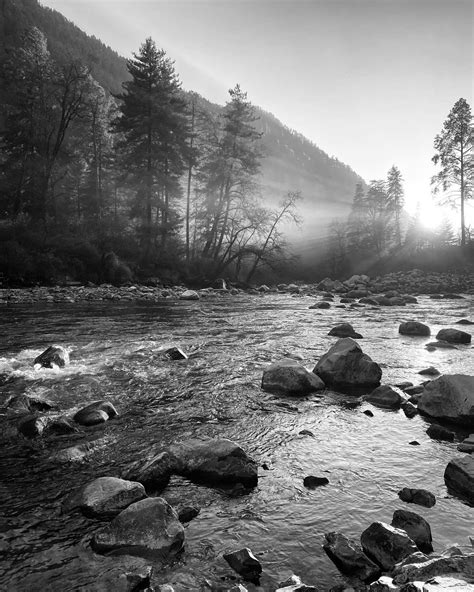 The Sun Setting Over A River In The Himalayas R Photo