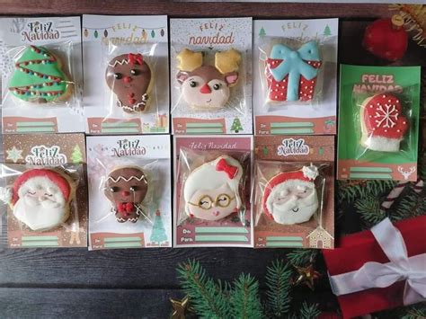 Twelve Decorated Christmas Cookies With Santa Claus And Other Holiday