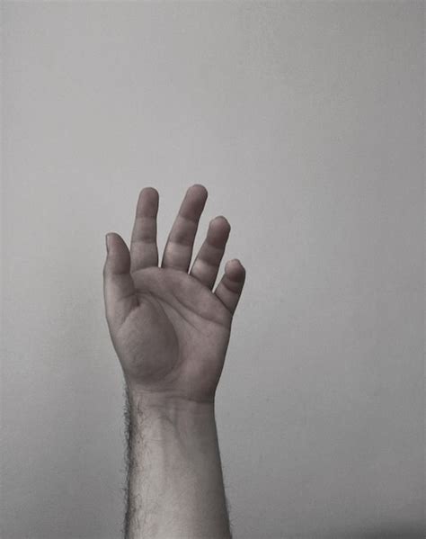 Premium Photo Cropped Hand Of Man Gesturing Against Wall