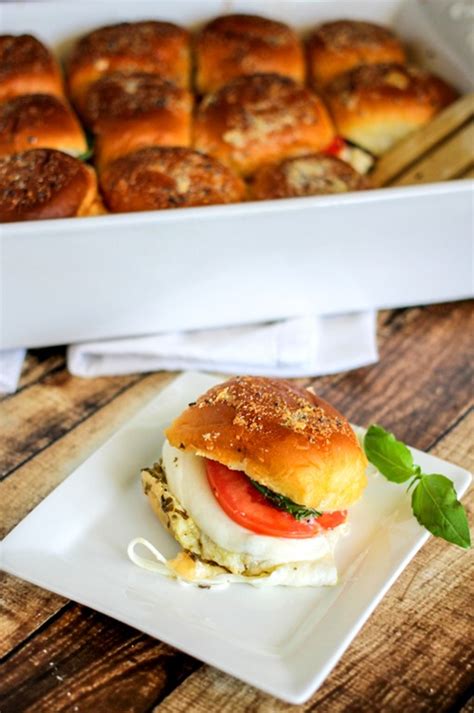 Caprese Sliders With Baked Tomato Mozzarella Basil Leaves And Pesto