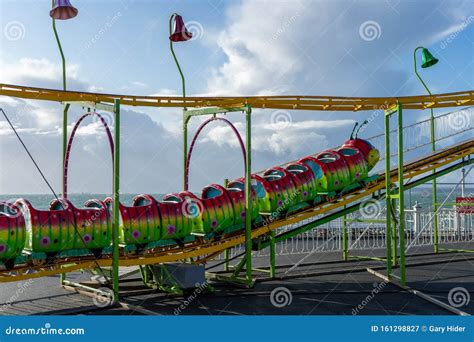 A Children`s Caterpillar Roller Coaster Ride At The Fairground Or