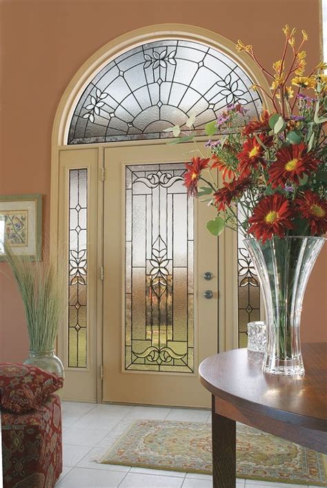 Cadence Door Glass Flows Into Floral Inspired Bevel Clusters Defined With A Patina Finish That