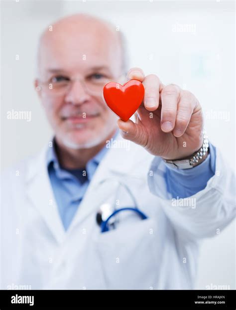 Doctor Holding An Heart Cardiologist And Cardiovascular Diseases