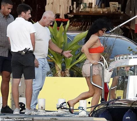 Lauren Sanchez Shows Off Her Enviable Curves In An Orange Bikini And TINY Tweed Shorts As She