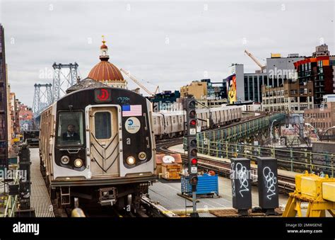 Subway train pulls into the Marcy Street elevated subway station in the Williamsburg ...