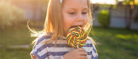 Premium Photo Portrait Of Cute Girl Holding Ice Cream