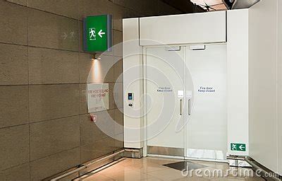 Fire Exit Way Door And Fire Exit Sign Light Box In The Airport Terminal