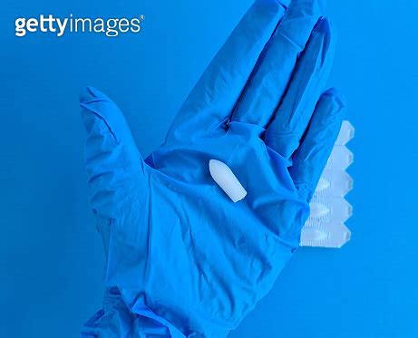 Suppository For Anal Or Vaginal Use In Hands Of Doctor With Gloves