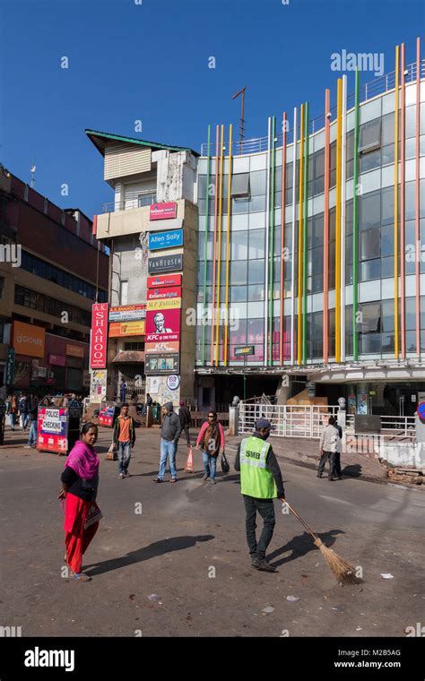 Sweeping the road at Police Bazaar outside shopping centre, Shillong ...