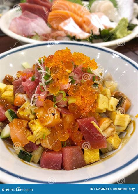 Fish Chirashi Japonese Food On Bowls With Wooden Hashis Stock Photo