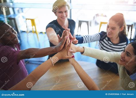 United In The Name Of Friendship A Group Of Happy Friends High Fiving