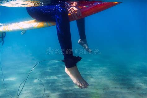 Surfer Woman Is Sitting On Surfboard Underwater Surfer And Ocean