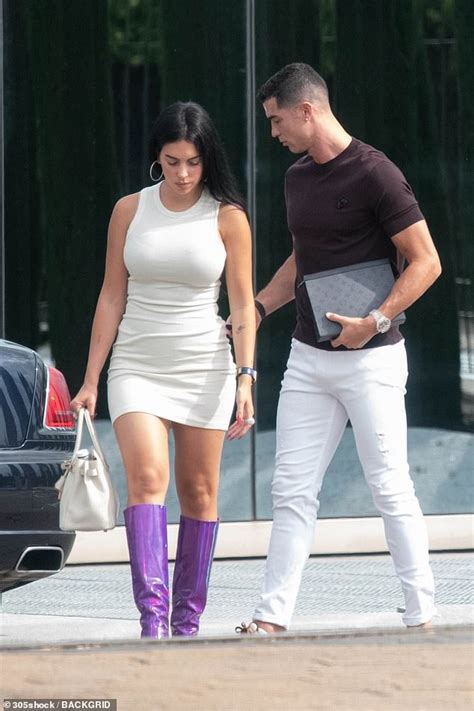 Georgina Rodriguez Looks Stunning In A Cream Dress And Purple Boots As