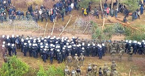 Tension Mounts As Soldiers And Migrants Mass At Belarus Poland Border