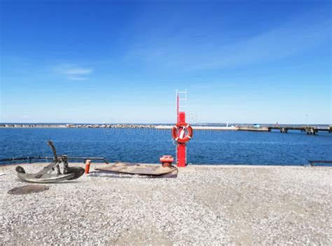 Porto Di Tallinn Estonian Symbol Flag And Red Lifebuoy On Boat Sea