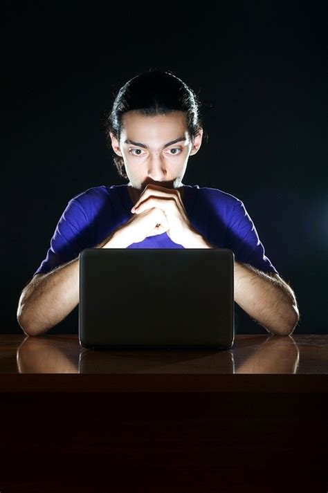 Hacker Sitting In Dark Room