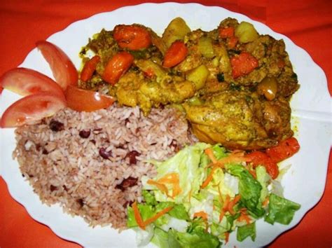 A Beautiful Plate Of Jamaican Curry Chicken Rice And Peas And Salad Jamaican Recipes Jamaica