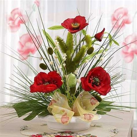 gorgeous red poopy flower arrangements  remembrance day table