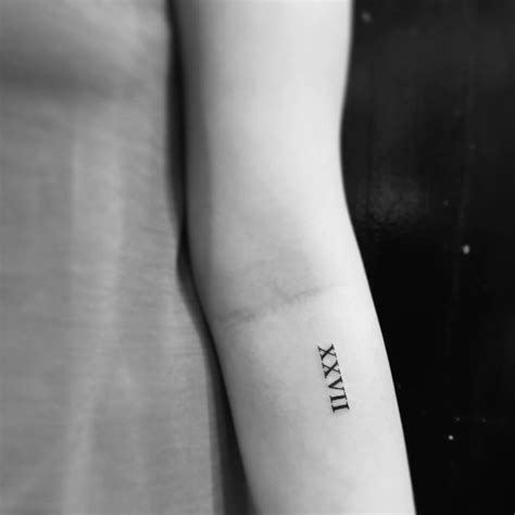 Roman Numerals Tattoo Located On The Inner Forearm