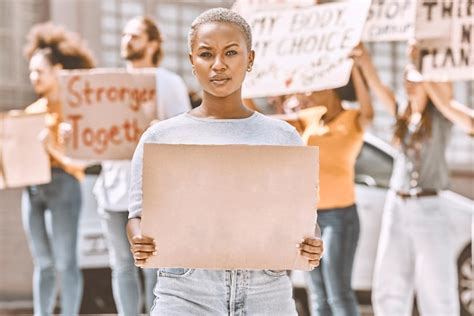 Premium Photo | Protest sign and mockup with a black woman activist holding cardboard during a ...