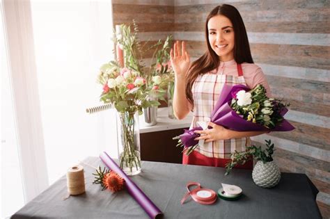 Premium Photo Female Florist At Work Pretty Young Dark Haired Woman