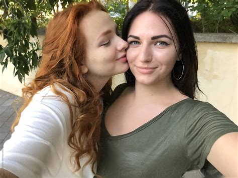 A Lesbian Couple Taking A Selfie Outdoors By Stocksy Contributor Alexey Kuzma Stocksy