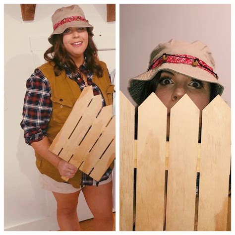 a woman holding two pieces of wood in front of her face and behind the ...