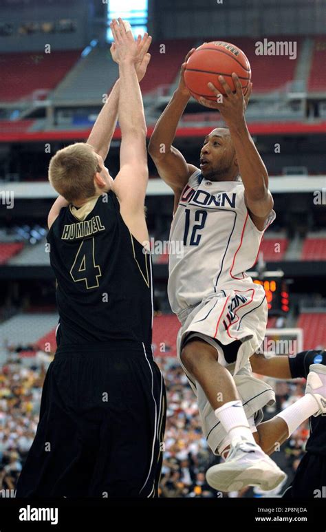 Connecticuts Aj Price Right Drives To The Basket Against Purdues