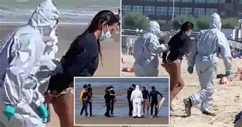 Woman Handcuffed On Beach For Surfing While Infected With Coronavirus