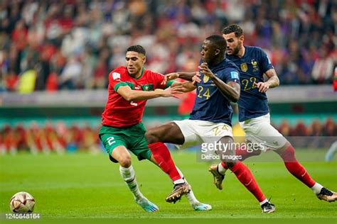 Achraf Hakimi Of Morocco And Ibrahima Konate Of France Battle For The