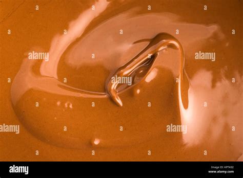 Background Of Melted Milk Chocolate Stock Photo Alamy