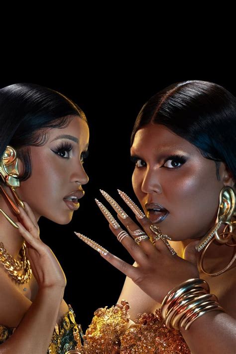 Two Beautiful Women With Gold Jewelry On Their Face And Hands Posing