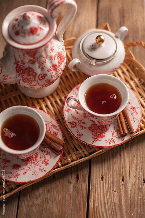 Two Cups Of Tea On A Wooden Table By Mosuno