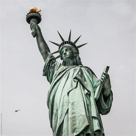 Helicopter Flying Besides The Statue Of Liberty New York Del