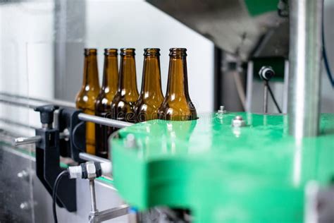 Beer Bottles On Conveyor Belt In Bottling Plant Stock Image Image Of