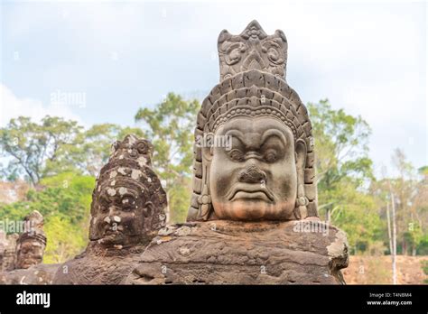 Ancient Hindu Statues Along Sides Of The South Bridge Into Angkor Thom