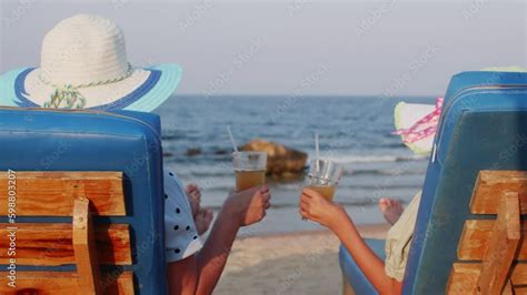 Women Relax Sit In Sunbeds Drink Cocktails In Summer Holidays On Ocean