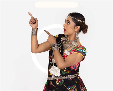 Tharu Girl in Traditional Dress Pointing Right - Photos Nepal