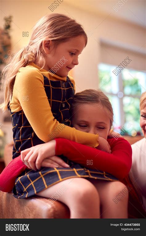 Two Sisters Hugging Image And Photo Free Trial Bigstock