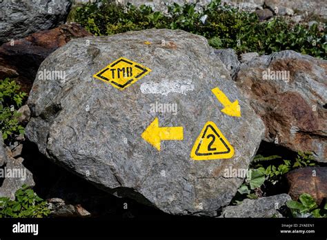 The Tour Du Mont Blanc Trail Marker Painted On A Rock Aosta Valley