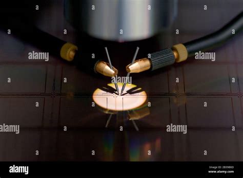 Close Up Of Examining A Sample Of Microchip Transistor With Probe