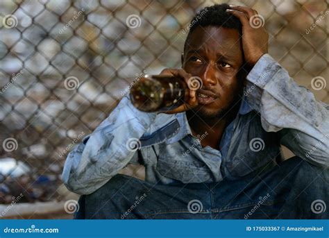 Depressed Young Homeless African Man Drinking Beer Stock Image Image