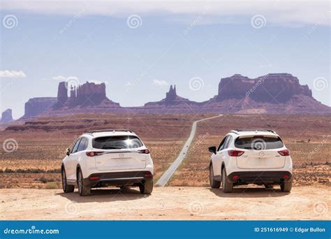 Mazda Suv At A Famous Scenic Road With Mountains In Background